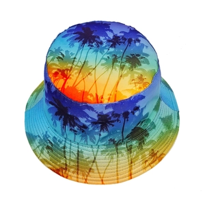 Close-up of tropical palm tree silhouette on gradient orange, yellow, and blue bucket hat