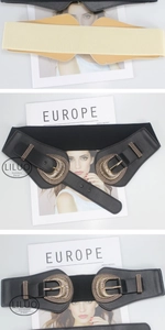 Detail of wide elastic waist belt with vintage horseshoe buckle and faux leather texture