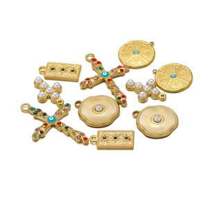 Golden stainless steel cross and evil eye charms with pearls and colorful rhinestones