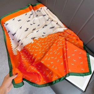 Japanese style silk scarf with orange geometric horse pattern and green border