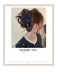 Navy tweed triangle hair claw clip with gold button detail shown on model back view