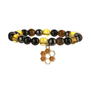 Bracelet en perles de citrine jaune et obsidienne avec pendentif abeille dorée et alvéole