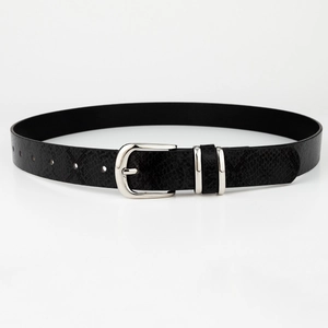 Close-up of black leather belt with snakeskin texture and silver polished pin buckle