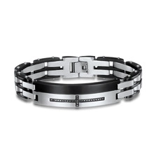 Detail of men's cross bracelet with black cubic zirconia and polished steel folding clasp