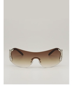 Detail of Y2K rimless sunglasses featuring silver snake-shaped metallic hinge decorations