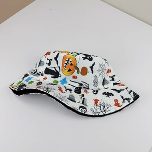 Close-up of Halloween bucket hat featuring printed pumpkins, ghosts and bats patterns