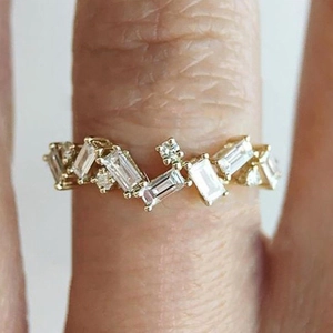Gold ring for women with rectangular and round zirconia stones in a unique baguette style