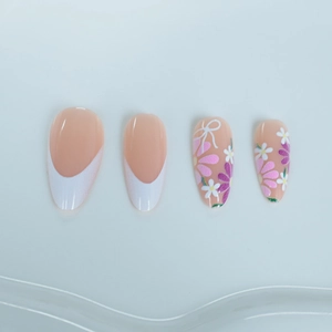 French daisy almond press-on nails with white tips and floral bow designs