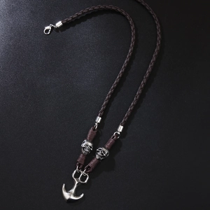 Retro anchor pendant necklace with skull beads on brown braided cord, black background