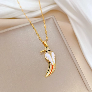 Detailed close-up of hummingbird pendant with enamel wings and rhinestones on gold chain