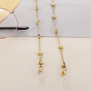 Detail of gold star eyewear chain with stainless steel links and anti-slip rubber loops