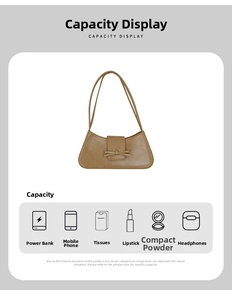 Detail view of khaki baguette bag capacity showing storage for phone and cosmetics