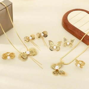 Elegant gold stainless steel jewelry set with butterfly charms and white pearls