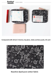 Detail of black paisley coin purse in pure cotton with pink tassel and compact size