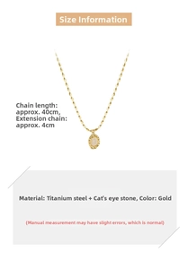 Close-up of vintage gold cat eye stone pendant necklace with titanium steel link chain
