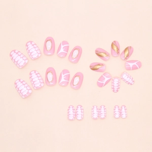 Detailed set of 24 press on nails featuring pink tones and golden feather patterns