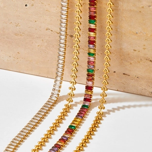 Gold Cuban link and tennis bracelets set with colorful cubic zirconia and beads