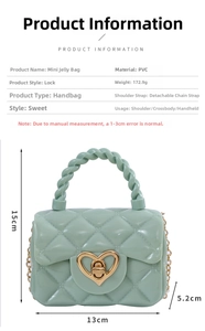 Detail view of mini mint green jelly bag featuring gold heart clasp and woven handle