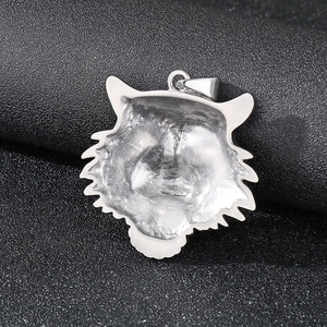 Hip hop silver tiger head pendant with crystal accents on a dark textured background
