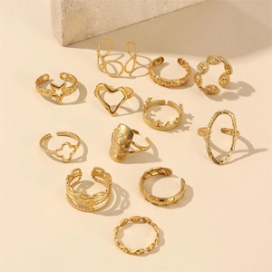 Set of 11 luxury 18k gold plated rings with heart star moon designs in a layered stack