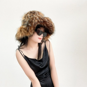 Close-up of fluffy faux fur bucket hat with brown and black mixed long hair texture