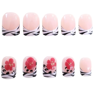 Short square press-on nails with zebra stripes, French lines, and red flower designs