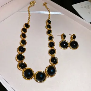 Vintage French style resin black and gold round pendant necklace and earrings jewelry set