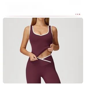 Detail view of burgundy yoga set featuring white contrast binding and high elastic fabric
