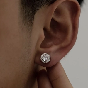Men's halo stud earring featuring a large round zircon stone with small diamond accents