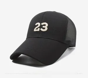 Detail of breathable mesh back and 3D embroidered number 23 on a black baseball cap