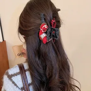 Grey knitted hair claw clip featuring a red pony plush and plaid bow for women
