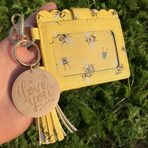 Yellow bee print card holder with leather texture, tassel, and wooden i love you charm