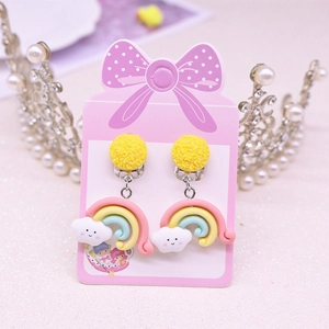 Cute kids clip-on earrings with rainbow and smiling cloud charms on pink bow card