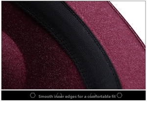 Detailed close-up of smooth interior stitching and black trim on a burgundy wool felt hat