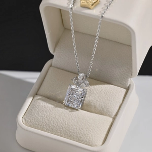 Detailed macro view of S925 silver necklace with rectangular crystal pendant in a gift box