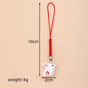 Cute white bunny bell charm with red woven lanyard showing size 10cm and 4g weight