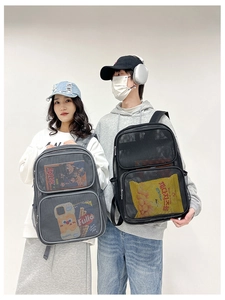 Detail view of large mesh backpacks in black and grey colors showing breathable fabric layers