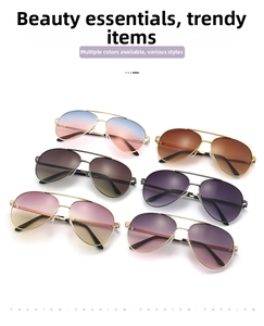 Detail view of six aviator sunglasses with metal frames and multi-color gradient lenses