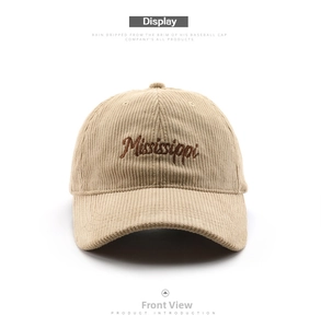 Close-up of beige corduroy baseball cap with brown Mississippi embroidery and texture