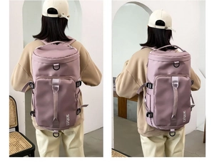 Detail of purple cylindrical travel backpack with waterproof nylon fabric and handle