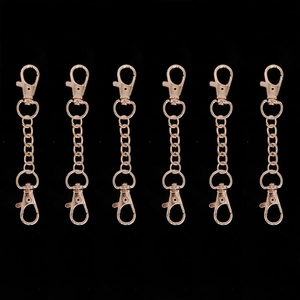 Detail of rose gold swivel lobster claw clasps with connector chains for DIY bags