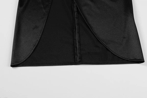 Detailed macro view of a smooth black satin dress showing high slit and neat stitching