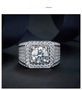 Macro view of luxury men's silver ring with 5 carat moissanite and multi-layer setting