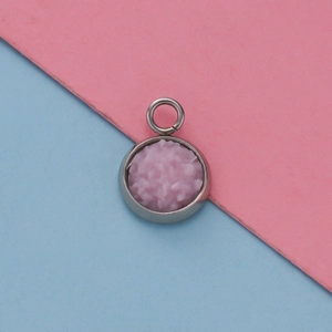 Macro shot of 12mm stainless steel pendant base with pink textured inlay and top ring