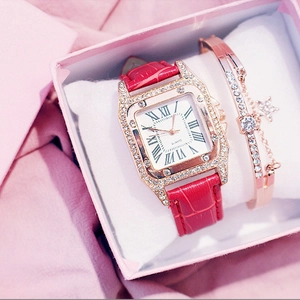 Detail of red leather square watch with rhinestones and matching star bracelet in gift box