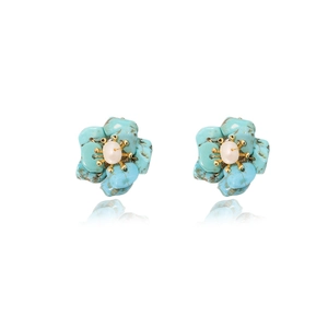 Artistic blue flower earrings with white pearls and gold metal frames on white backdrop