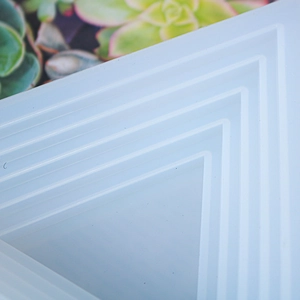Macro shot of tiered triangular silicone resin mold for DIY handicraft step trays