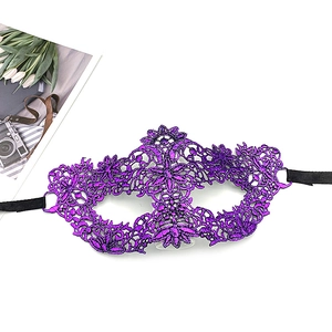 Detailed view of purple lace eye mask with intricate floral crochet and black silk ties