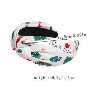 Detail view of knotted Christmas headband showing size dimensions and festive tree patterns