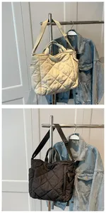 Quilted tote bags in beige and black colors with adjustable strap and dual side pockets